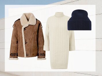Une veste en peau de mouton marron, une robe tricotée blanche à col roulé et un bonnet bleu foncé en tricot sont disposés côte à côte sur un fond clair. | © aboutyou.de 